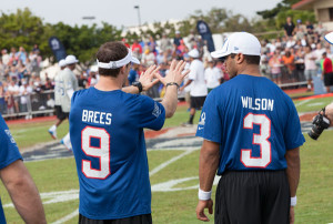 Brees and Wilson scheming to get on an amusement park ride