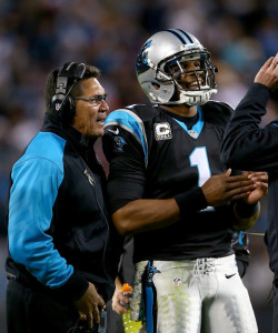 Cam disingenuously listening to his head coach