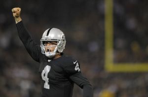 Carr holds up the number of Raiders wins